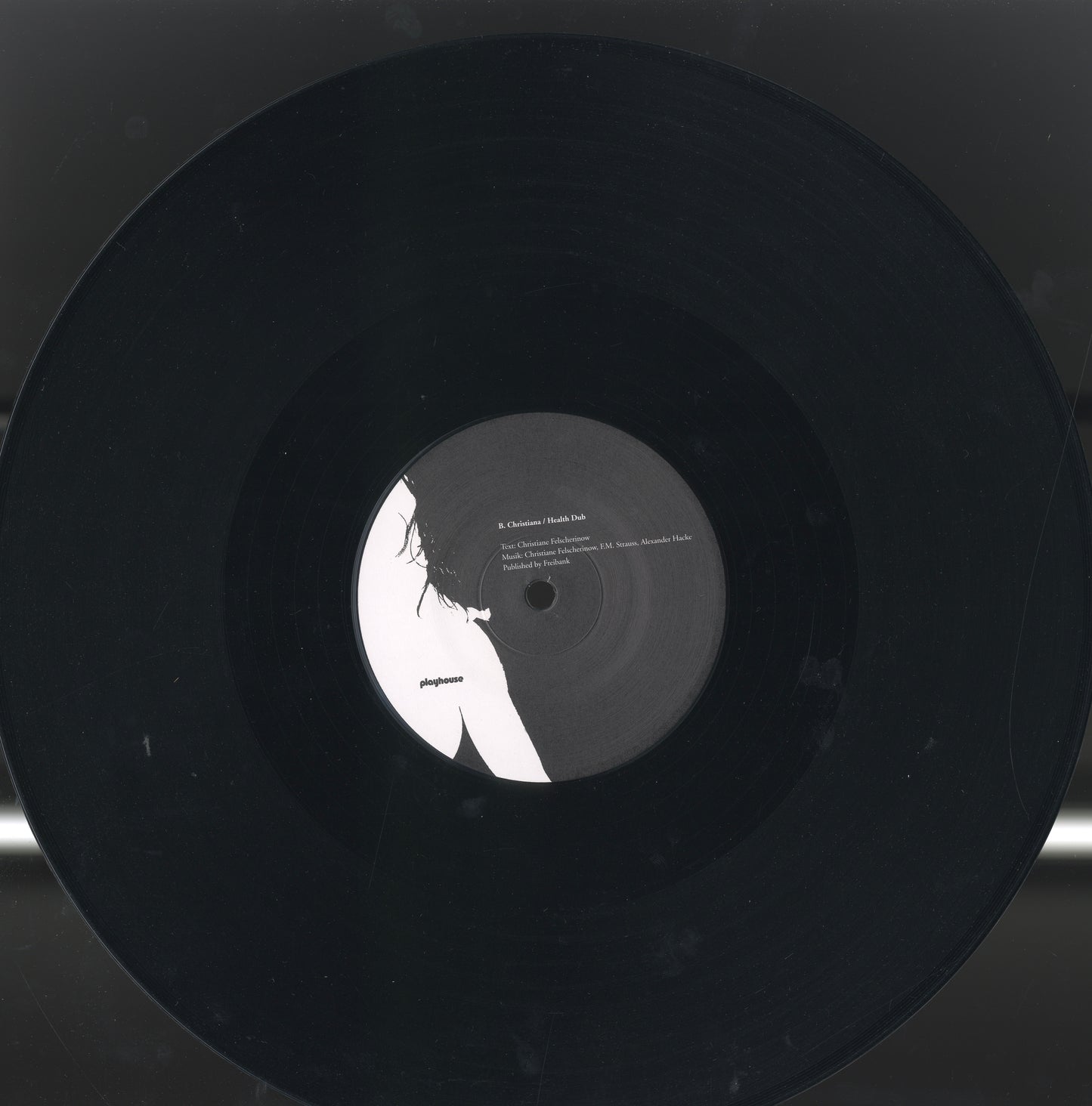 Close-up detail from the 12-inch vinyl Wunderbar / Health Dub — Christiane F.’s voice suspended in plastic and light.