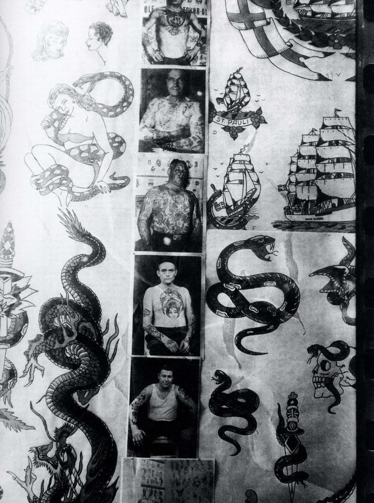 Black and white photograph of a graffiti-covered wall. intermission books.