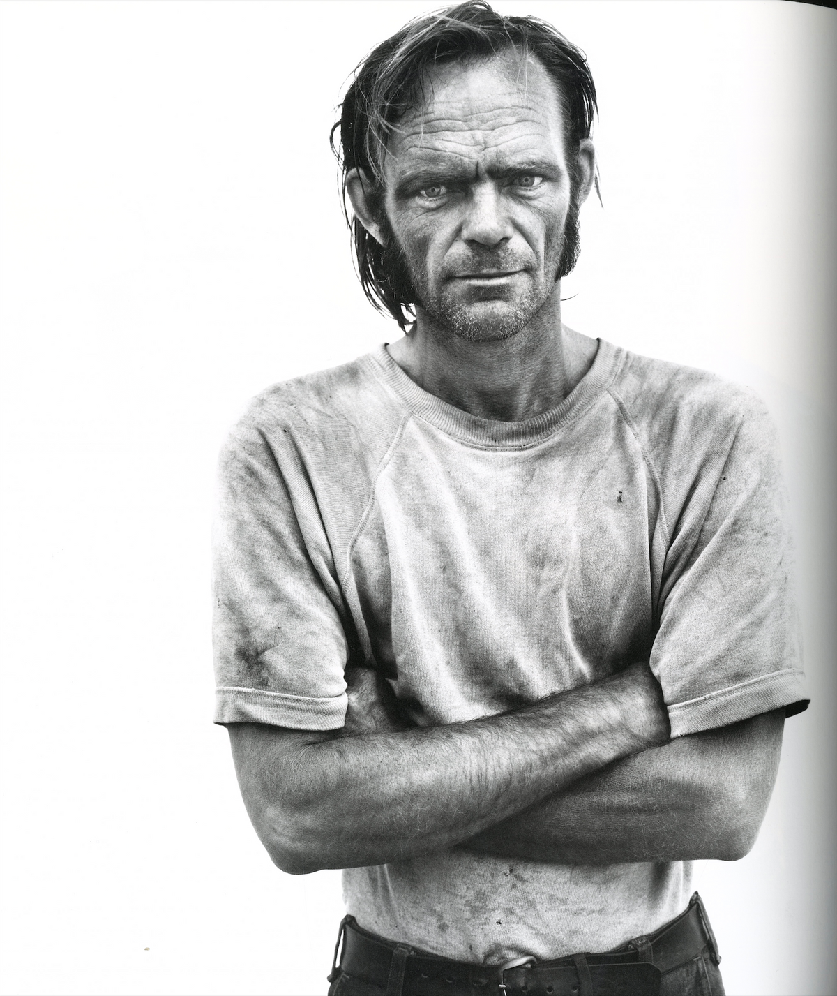 Richard Avedon In the American West interior worker portrait crossed arms white background black and white interior 1 intermission books.