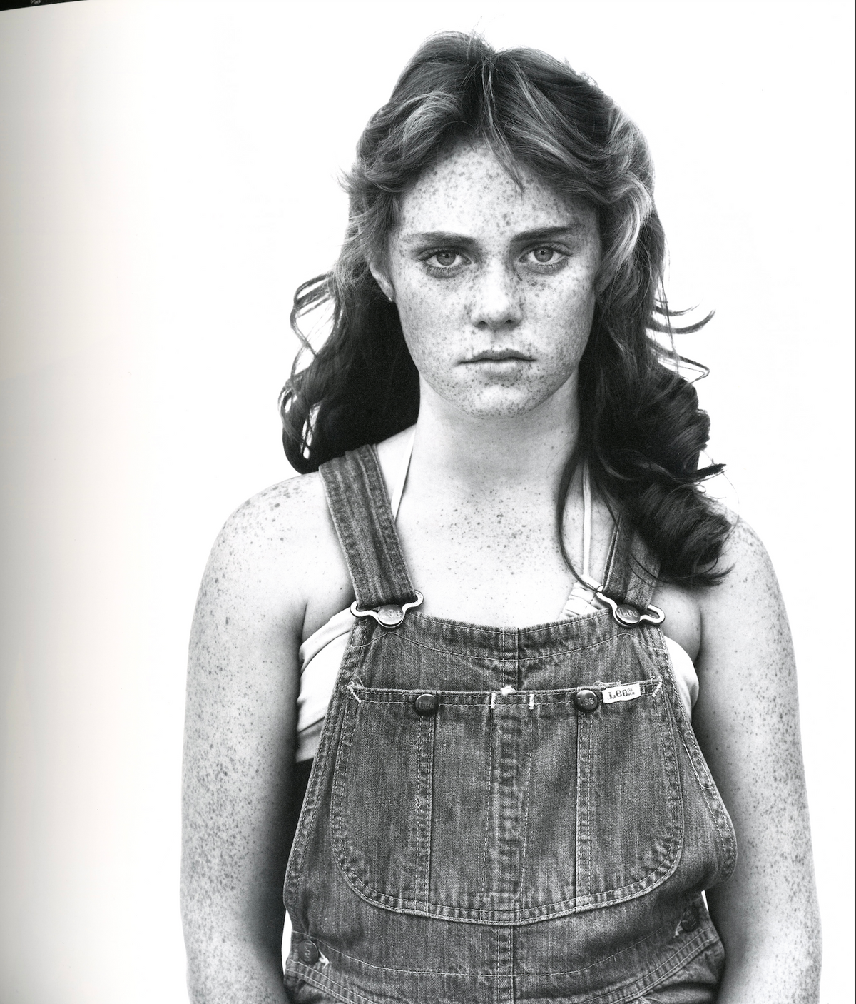 Richard Avedon In the American West interior young woman overalls portrait white background documentary interior 3 intermission books.