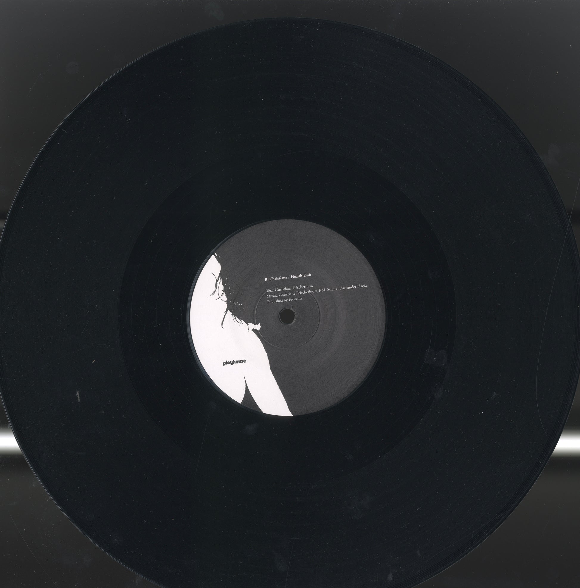 Close-up detail from the 12-inch vinyl Wunderbar / Health Dub — Christiane F.’s voice suspended in plastic and light.