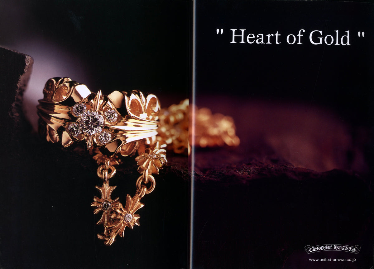 “Heart of Gold” spread in Chrome Hearts Magazine Vol. 1: gold Chrome Hearts ring with cross motif on a dark ground.