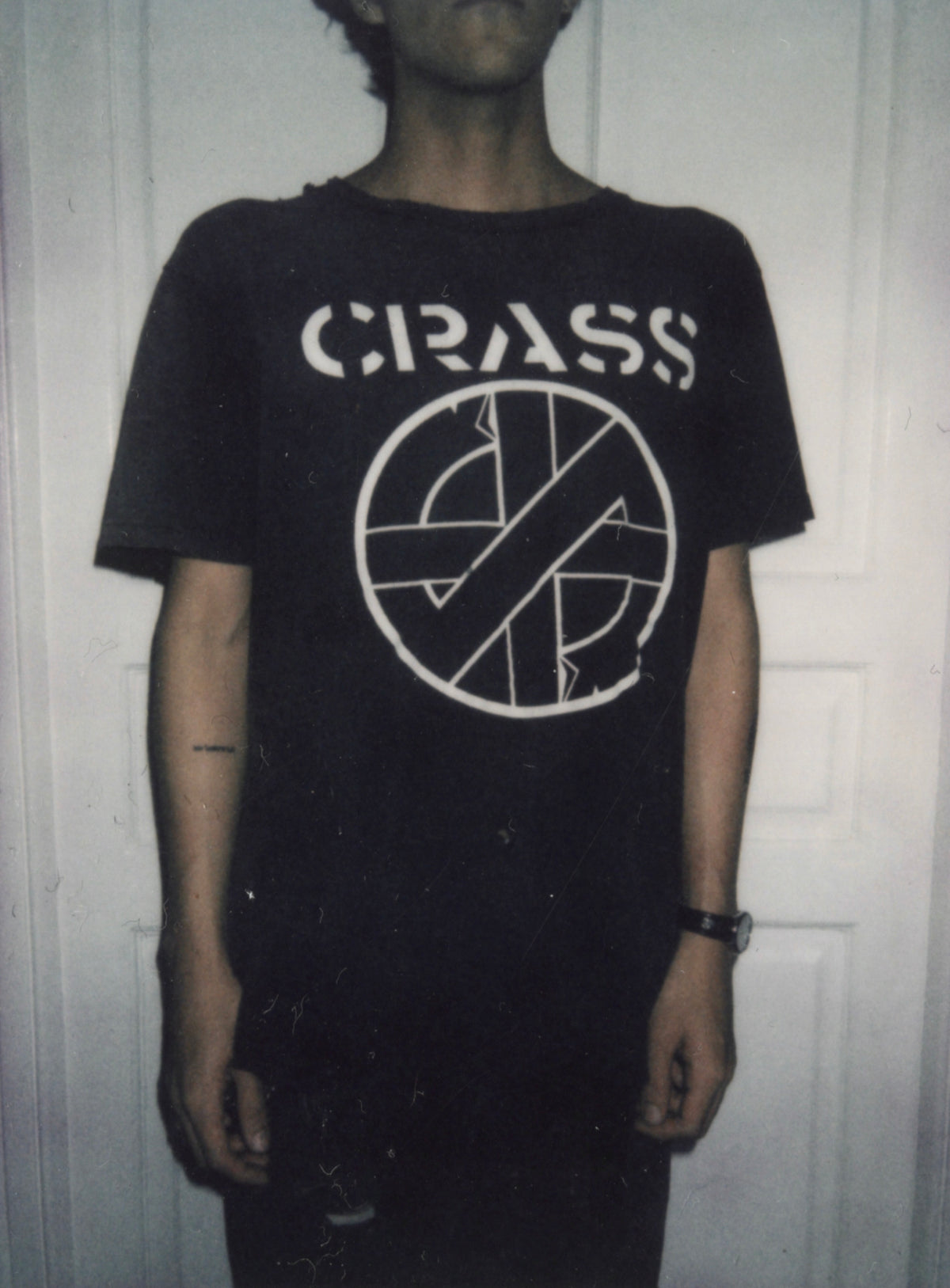 Vintage Crass logo T-shirt worn, front view.