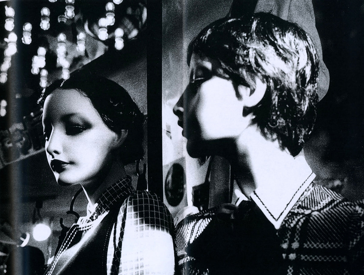 Two mannequin heads in profile behind shop glass, Daido Moriyama, Plastic Love.