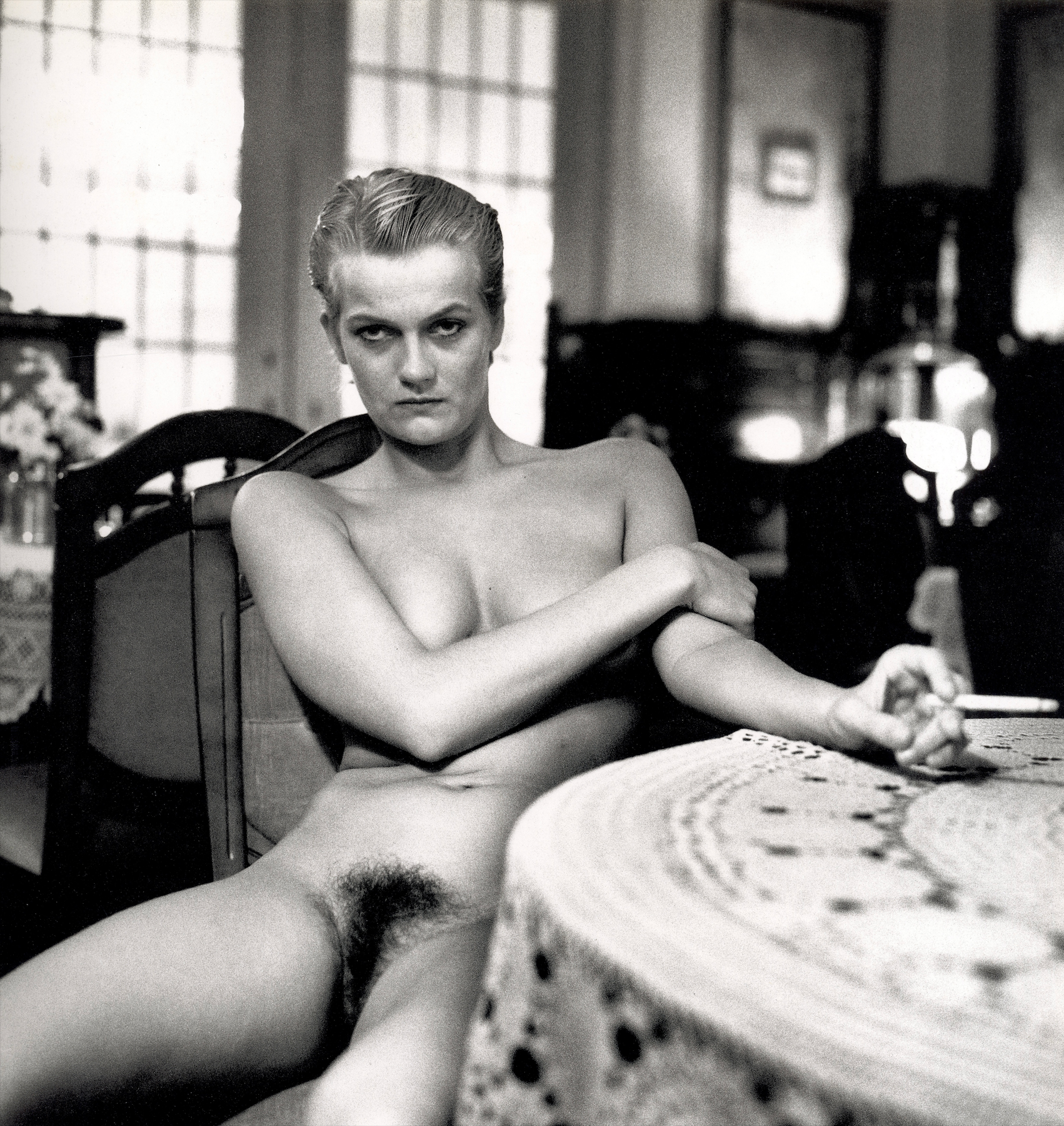 Interior photograph Helmut Newton fashion portrait editorial style.