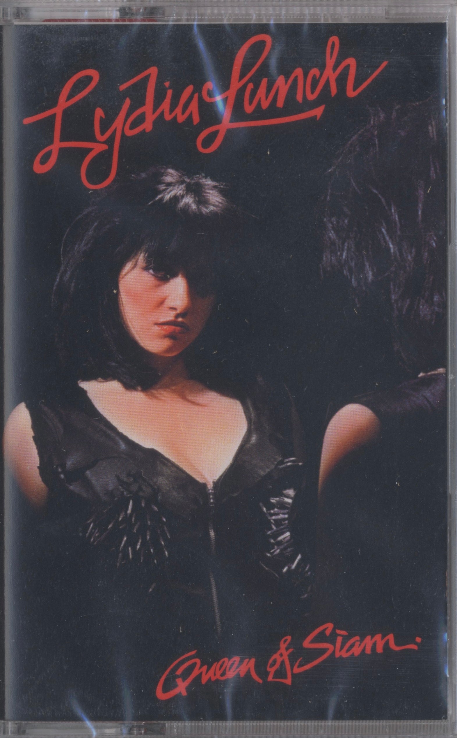 Front cover of Lydia Lunch’s Queen of Siam cassette — 2023 reissue by Radiation Records, a decadent fusion of jazz, no wave, and experimental cabaret.