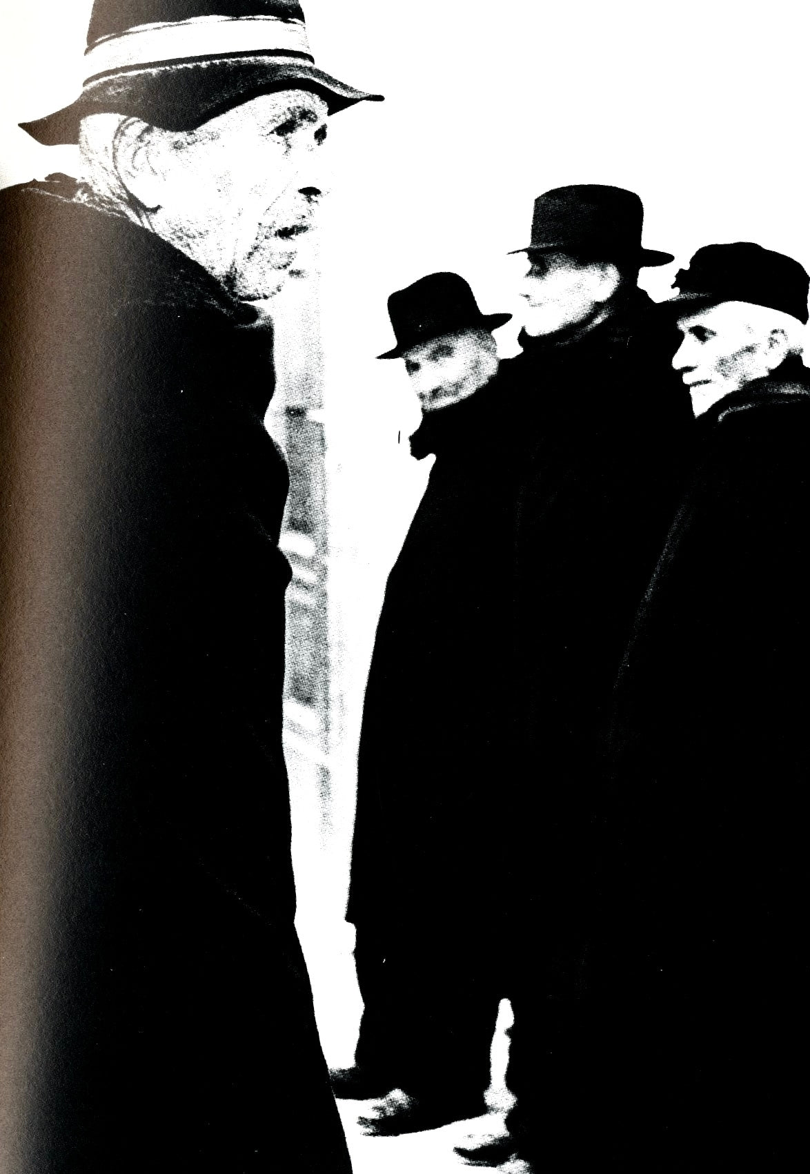 Mario Giacomelli portrait of elderly men in hats and heavy coats, close and high contrast.