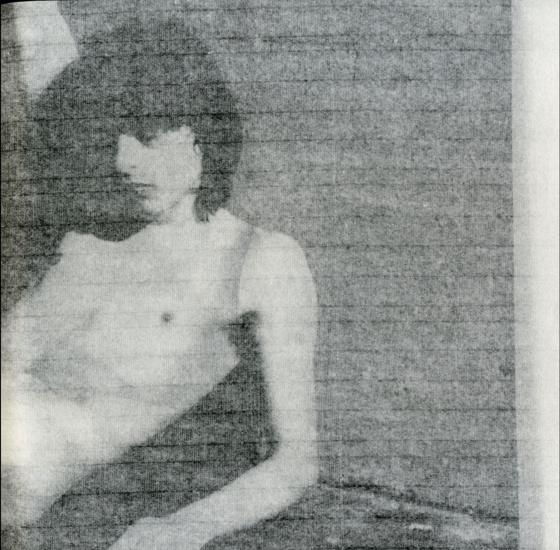 Interior spread of Guiones displaying layered rice-paper pages that reveal traces of the preceding image.