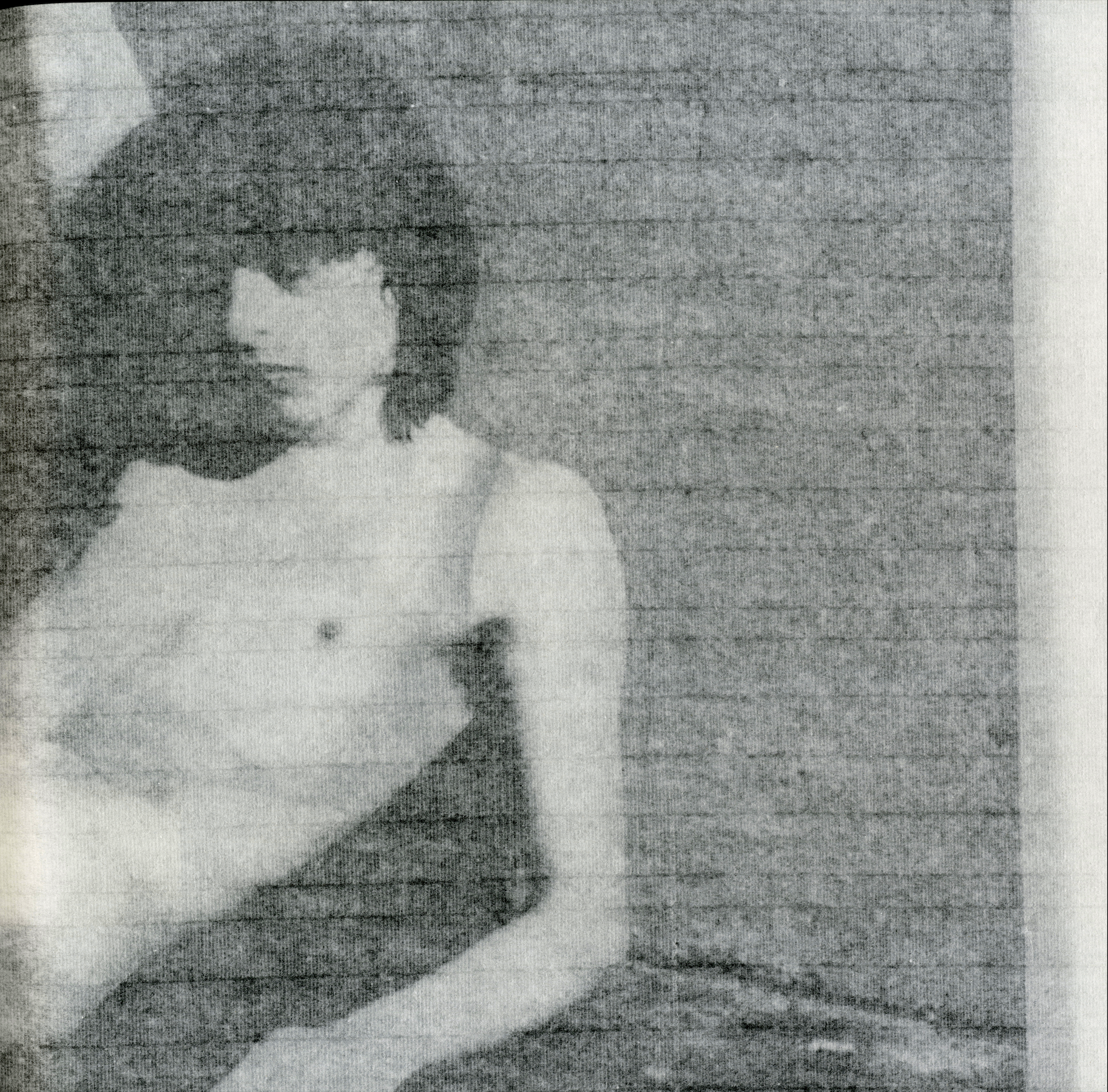 Interior spread of Guiones displaying layered rice-paper pages that reveal traces of the preceding image.