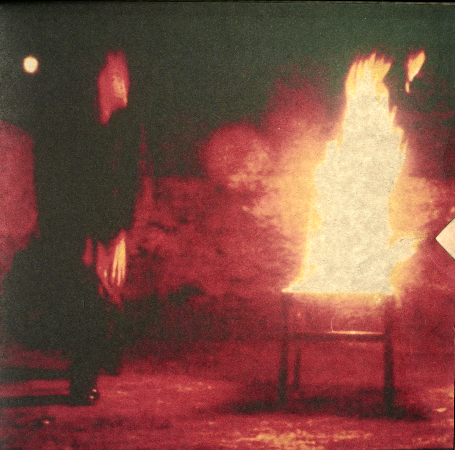 Black-and-white photograph of a figure arching backward in a performance pose from Guiones, 2021.