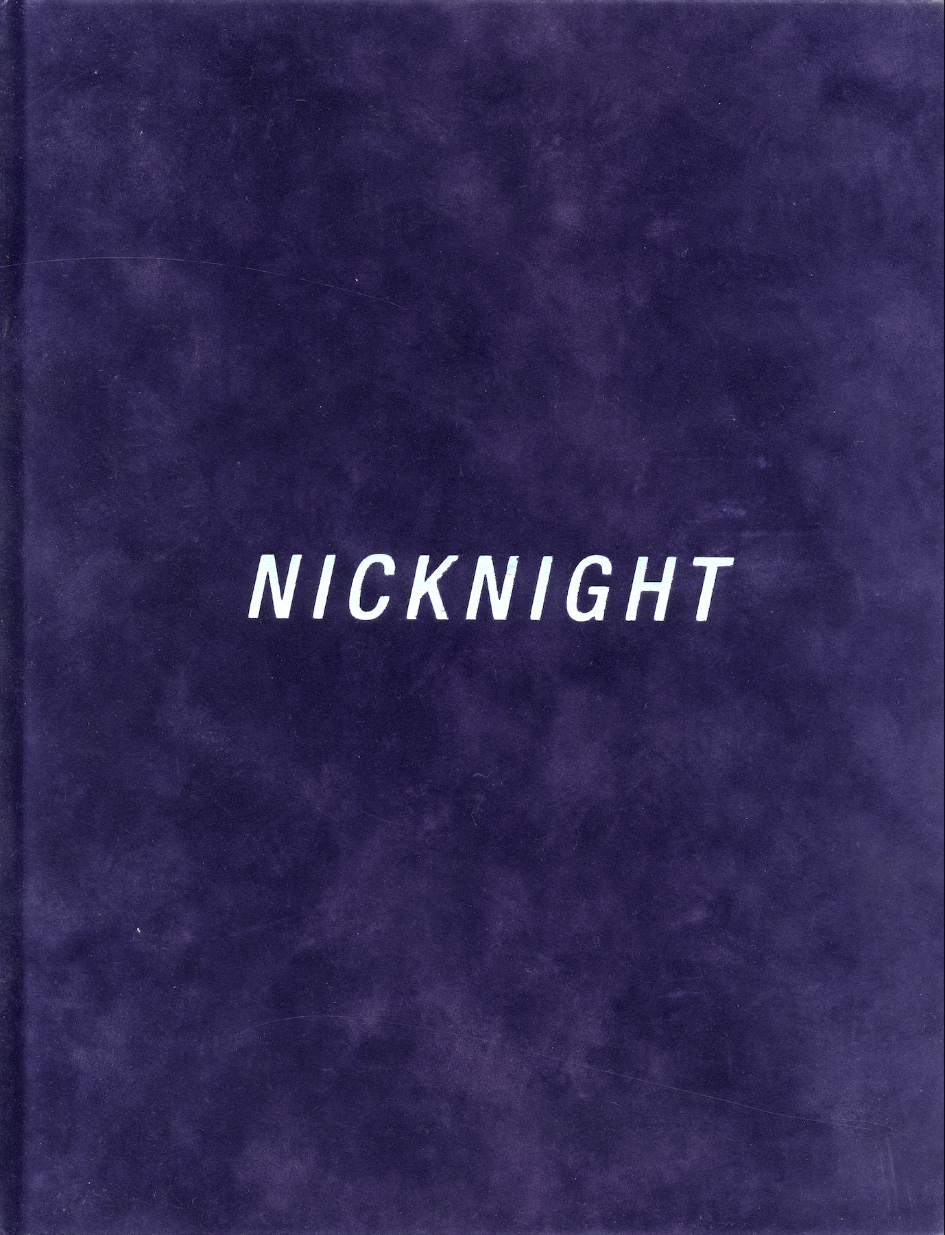 Front cover of Nick Knight monograph (1994), featuring purple velvet suede hardcover housed in original slipcase.