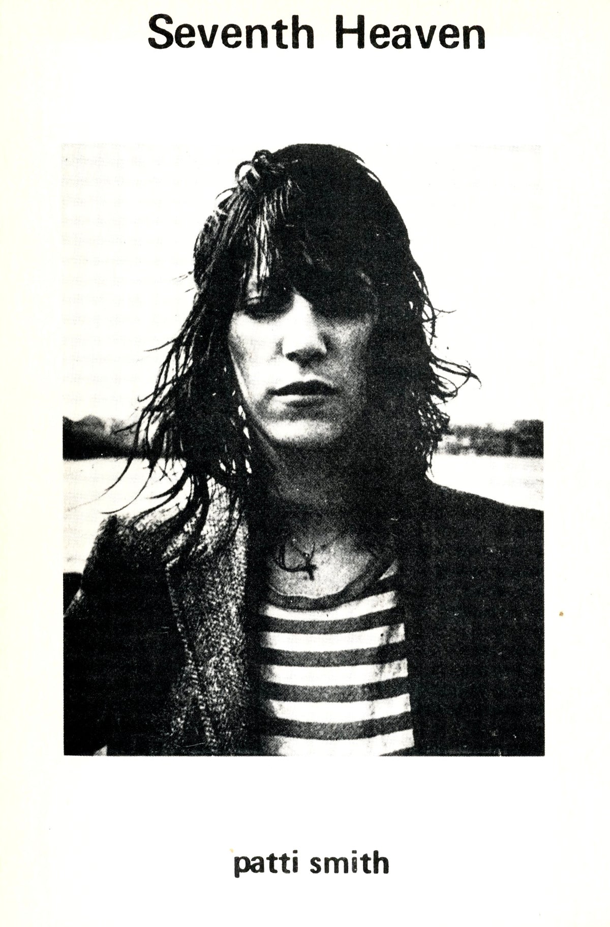Patti Smith Seventh Heaven (1972) poetry book, front cover with Judy Linn's black-and-white portrait of Smith in a striped shirt.