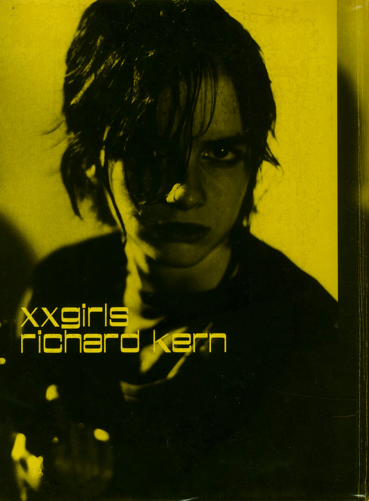 Cover of Richard Kern, XX Girls, Fiction Inc. 1996: yellow-toned portrait of a young woman with dark tousled hair.