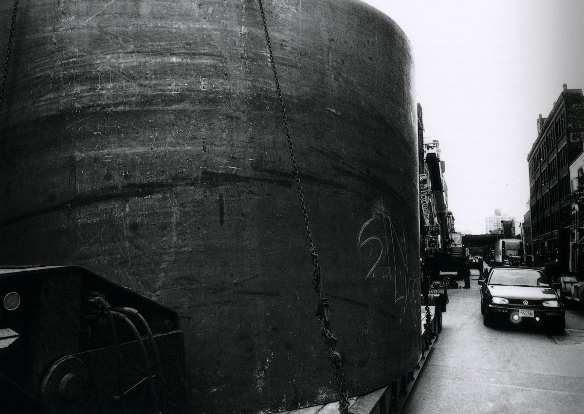View along the leaning steel walls of a torqued ellipse passage, Richard Serra: Torqued Ellipses.