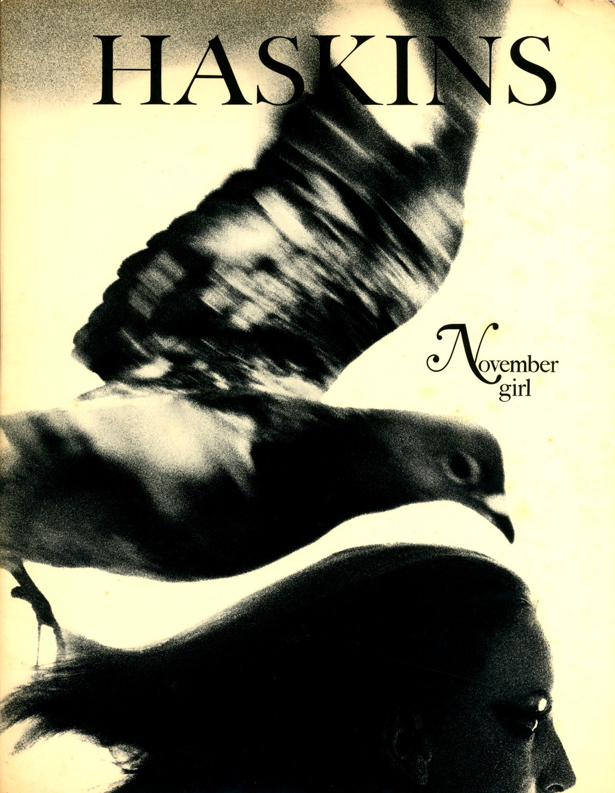 Dust jacket of Sam Haskins’ November Girl, 1967: a bird in flight above a woman’s profile on a cream ground.