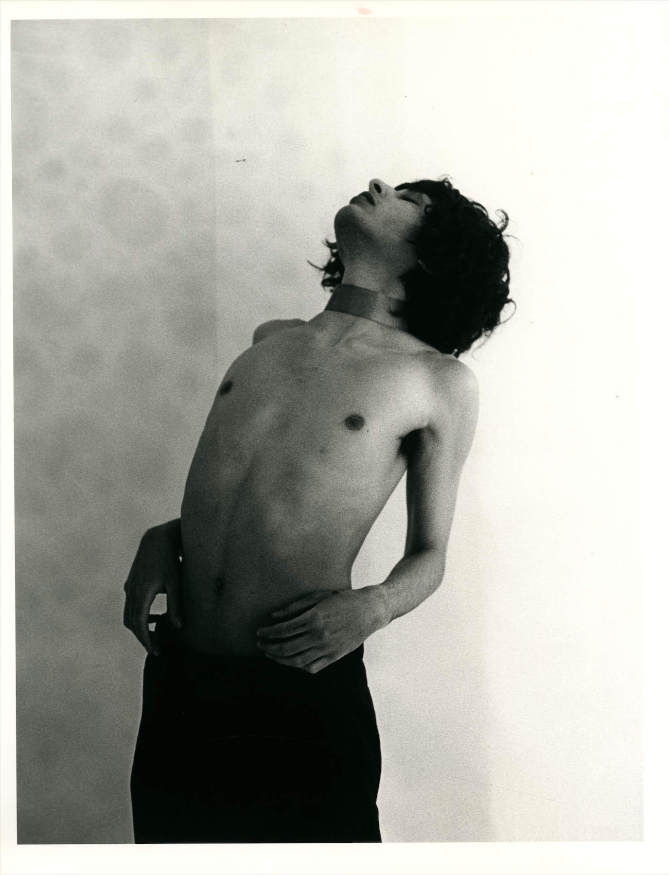 Silver-gelatin print “Untitled (Backbend with Ribbon)” in black and white, featuring a figure in a deep backbend holding a ribbon.