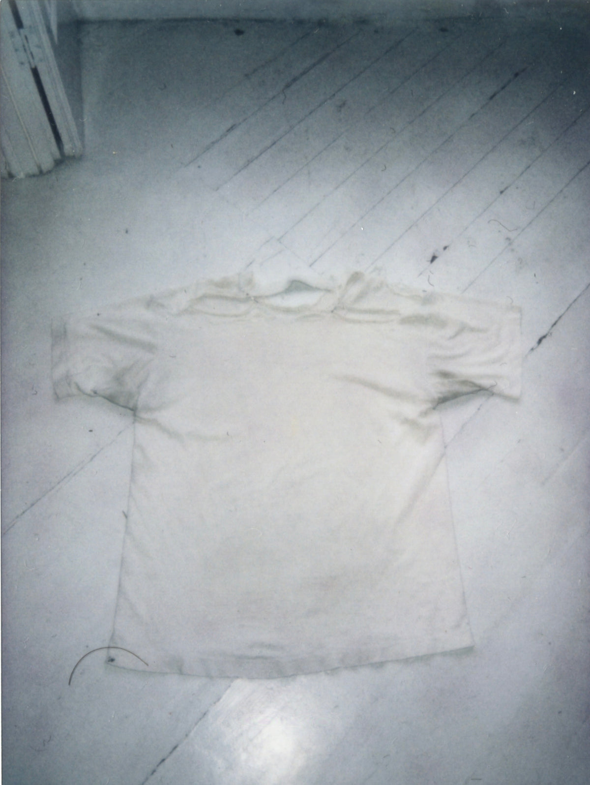 Back of the Sonic Youth T-shirt laid flat, showing the torn shoulder, thinning fabric and hem wear.