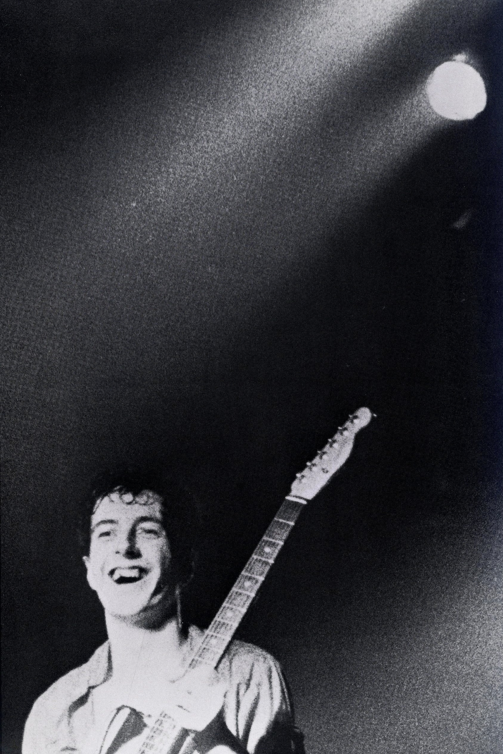 Documentary-style black-and-white image of The Clash captured by Pennie Smith.